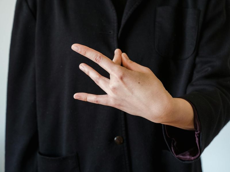 Person hands in a mudra position during meditation